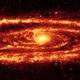  اسپيتزر تصویر زیبایی از کهکشان مارپیچی آندرومدا گرفته که نواحی مارپیچی بازوی کهکشان را در نور فروسرخ به همراه ستاره های پیر نشان می دهد.