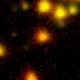 تلسکوپ فصایی اسپیتزر متعلق به آژانس فضایی ایالات متحده ( ناسا ) از میان ذراتی همچون غبار گروهی از کهکشان های پنهان غو